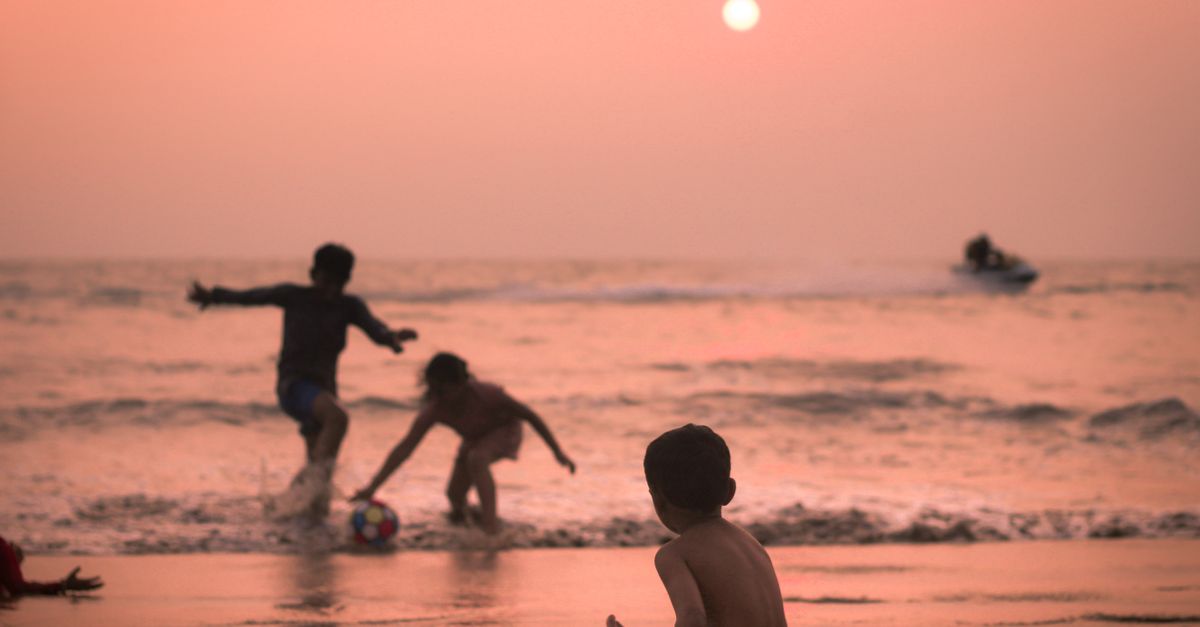 Andaman family tour package kids playing on beach